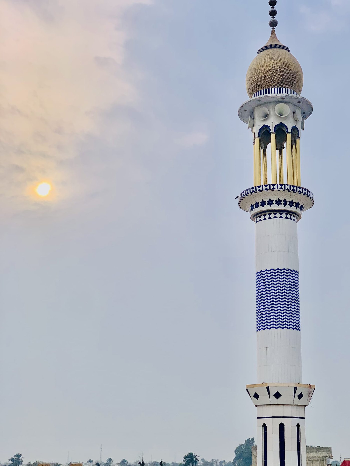 Jamia Mosque minaret at Japan Citi Bahawalpur against a soft evening sky